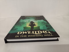 Cover of Dwelling in the Wishing Well by Madelaine Salvage *Kickstarter First Edition*